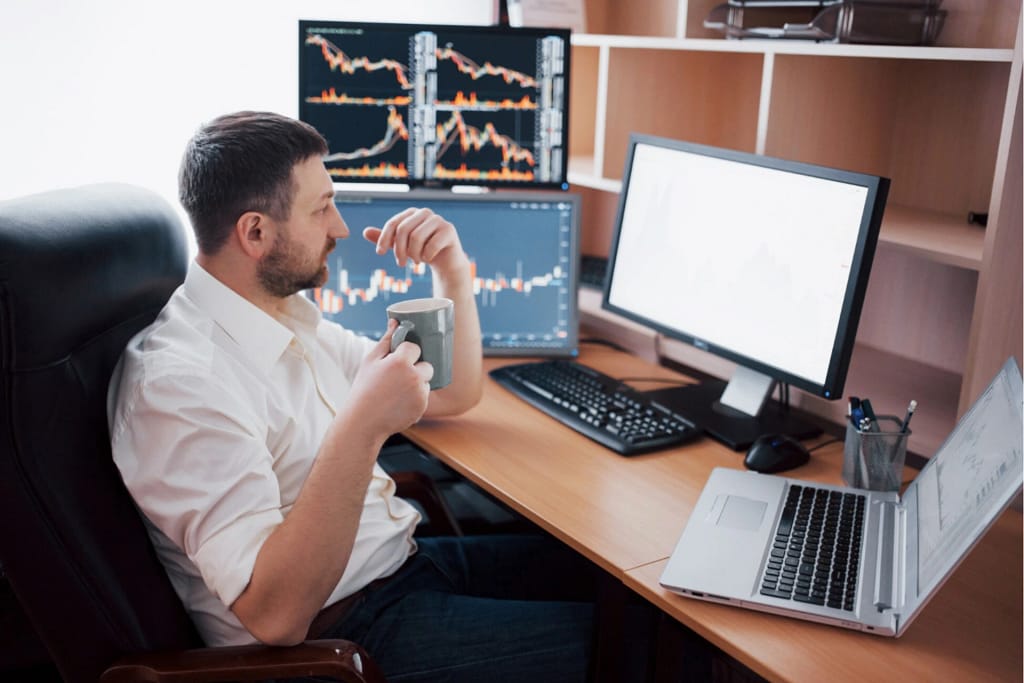 A man analysing graphs of stock market
