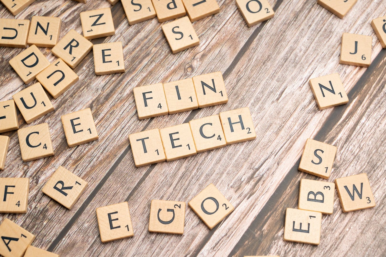 scrabble tiles spelling out the word fin tech